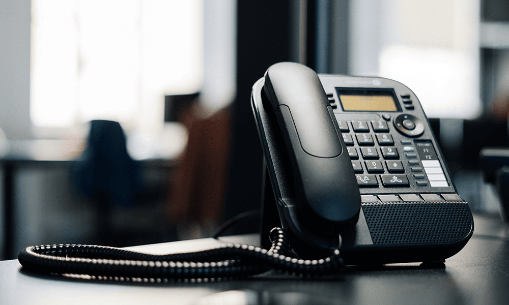 Office desk phone ready to ring with new leads generated through a demand generation strategy