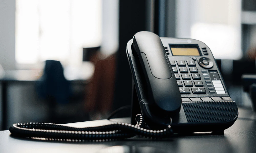 Office desk phone ready to ring with new leads generated through a demand generation strategy