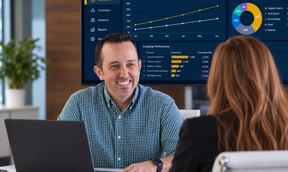 Scott Everhart reviewing campaign performance data with a client as he leads JSRG Ventures' fractional CMO practice